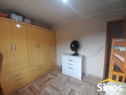 Terreno com 02 casas e sala comercial no bairro Guarani 
