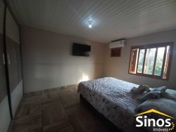 Terreno com 02 casas e sala comercial no bairro Guarani 