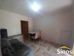 Terreno com 02 casas e sala comercial no bairro Guarani 