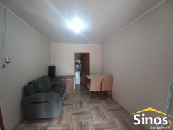 Terreno com 02 casas e sala comercial no bairro Guarani 