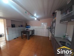 Terreno com 02 casas e sala comercial no bairro Guarani 