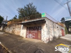 Terreno com 02 casas e sala comercial no bairro Guarani 