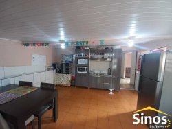 Terreno com 02 casas e sala comercial no bairro Guarani 