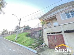 Terreno de esquina com sobrado no bairro Canudos 
