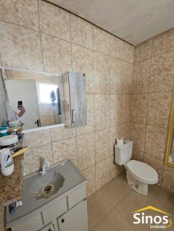 Terreno comercial com casa de 02 dormitórios no bairro Rio Branco 