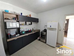 Terreno comercial com casa de 02 dormitórios no bairro Rio Branco 