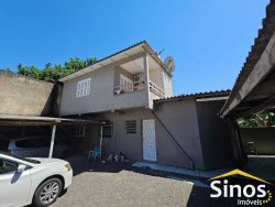 Terreno comercial com casa de 02 dormitórios no bairro Rio Branco 