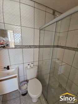 Terreno comercial com casa de 02 dormitórios no bairro Rio Branco 