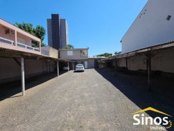 Terreno comercial com casa de 02 dormitórios no bairro Rio Branco 