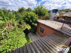 Casa com 05 dormitórios e prédio comercial no bairro Rondônia  