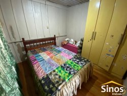 Casa com 05 dormitórios e prédio comercial no bairro Rondônia  