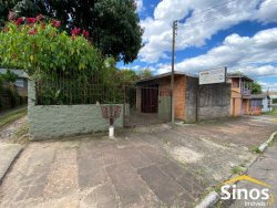 Casa com 05 dormitórios e prédio comercial no bairro Rondônia  