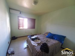 Casa com 03 dormitórios e sala comercial no bairro Rondônia 