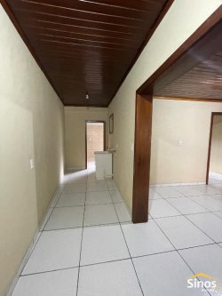 Casa com 03 dormitórios para locação no bairro Rondônia 