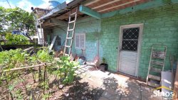 Terreno com 02 casas no loteamento Jardim Imperial  