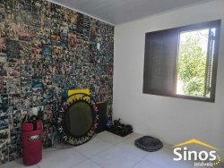 Terreno com 02 casas no bairro Lomba Grande 