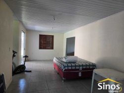 Terreno com 02 casas no bairro Lomba Grande 
