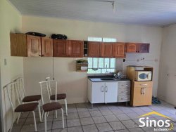 Terreno com 02 casas no bairro Lomba Grande 