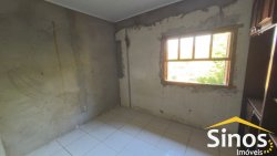 Casa com 03 dormitórios para locação no bairro Primavera  