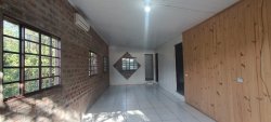 Terreno de esquina com construção no bairro Santo Afonso 