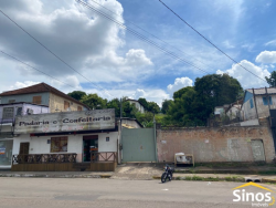 Terreno com construção no bairro Rondônia