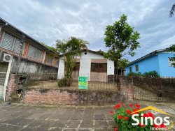 Terreno com construção no bairro Vila Nova