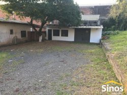 Terreno com construção no bairro Rondônia