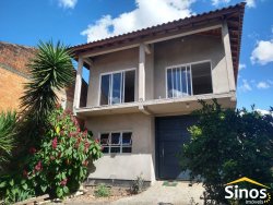 Terreno com 02 casas no bairro Lomba Grande
