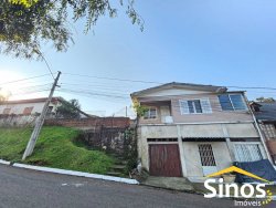 Terreno de esquina com sobrado no bairro Canudos