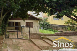Terreno com construção no bairro Vila Nova