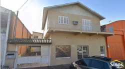 Prédio comercial com casa no bairro Ideal