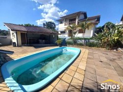 Casa com 03 dormitórios e sala comercial no bairro Rondônia