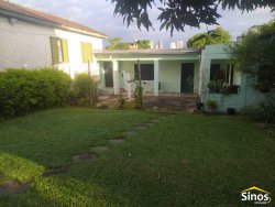 Terreno de esquina com casa no bairro Vila Nova