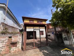 Terreno com 02 casas no bairro Guarani