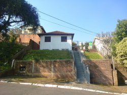 Terreno com 02 casas no Ideal
