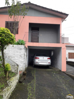 Terreno com duas casas no bairro Vila Nova