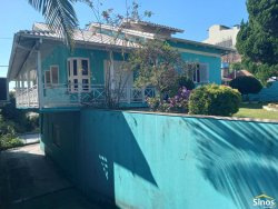Casa com 03 dormitórios e prédio comercial no bairro Rondônia 
