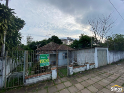 Terreno com construção no bairro Rondônia