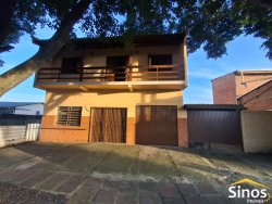 Casa comercial e residencial no bairro Scharlau