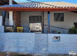 Casa com sala comercial no bairro Vila Nova