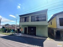 Terreno com construção no bairro Vila Nova